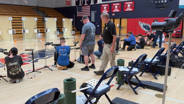CW3 James Tiddy, USA (Retired) walks the line during Monday's diagnostic match to ensure each athlete is handling the rifle in a safe manner for the match and provided detailed rule break downs through out camp.