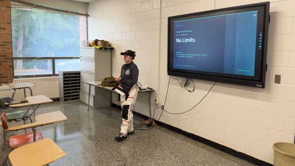 Coach Sahi Weiser gives the final classes before Friday's CMP Cup Match in full shooting gear, only moments before being reminded she could remove her coat and finally did
