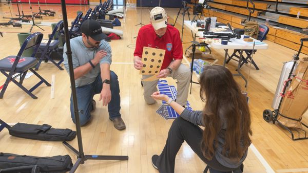 Coaches Angus Babcock and Sahi Weiser double checking their own kneeling postions with SC CMP State Director LTC Paul Davis (USA), Retired before teaching a session to the campers.