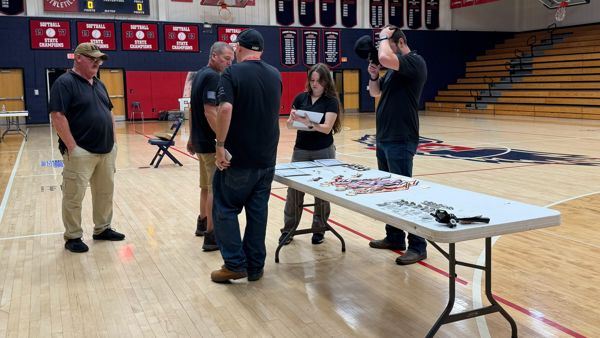 Left to right - SFC Holley, CW3 Tiddy, CMP State Director NC Rich Weiser, Coaches Sahi Weiser and Angus Babcock review and verify all awards before their presentation.